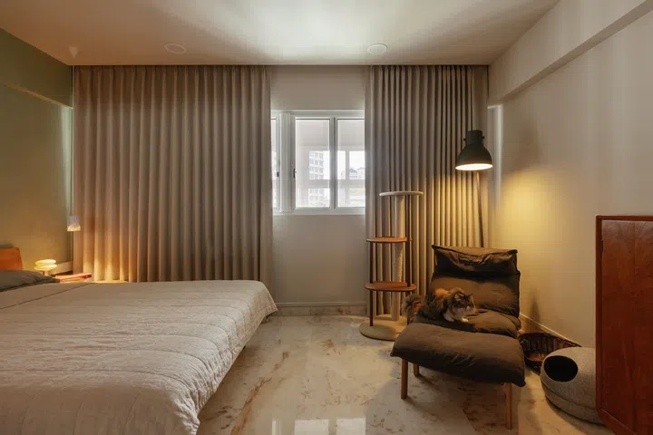 The master bedroom bears muted and quieter colours.