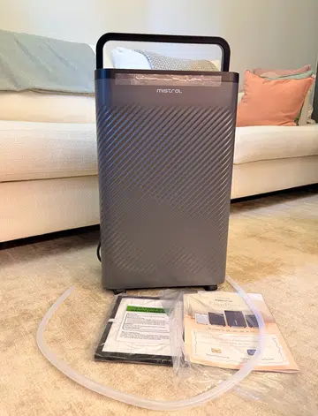Mistral ÉlanPure 5-in-1 Smart Dehumidifier & Air Purifier (product code number MDH1603DW) comes with a continuous draining pipe, HEPA filter, and mobile app setup instructions.