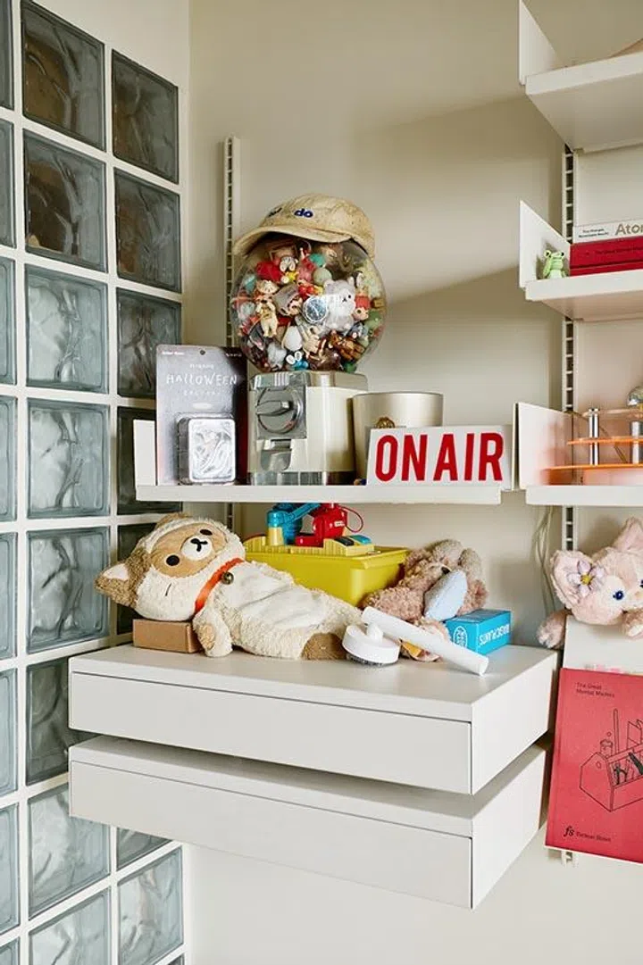 A tabletop gachapon jar filled with collectibles doubles as self-reflection—playful, visible, and a reminder of the habits we build.