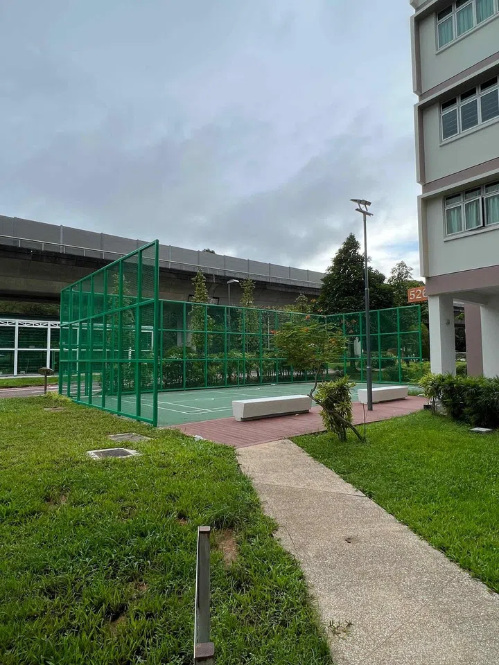 Walking view of the tennis court at Costa Ris HDB estate. Photo by Jyn Teo