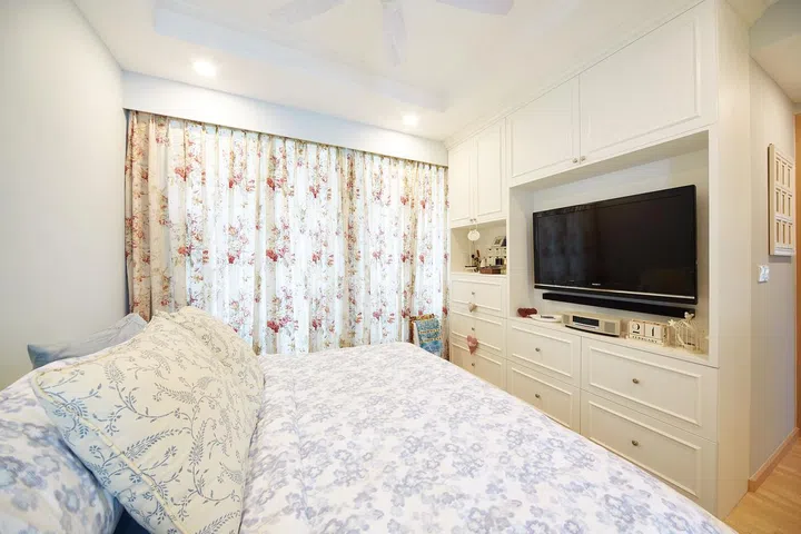 The master bedroom has a custom-made cabinet, which houses the TV set. 