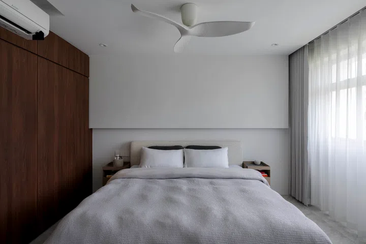 Sheer curtains soften the light, balancing privacy with openness.