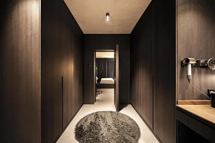 Hallway leading from the bathroom to the master bedroom, keeping the master bedroom privately stowed away in a 3-room HDB flat in Ang Mo Kio.