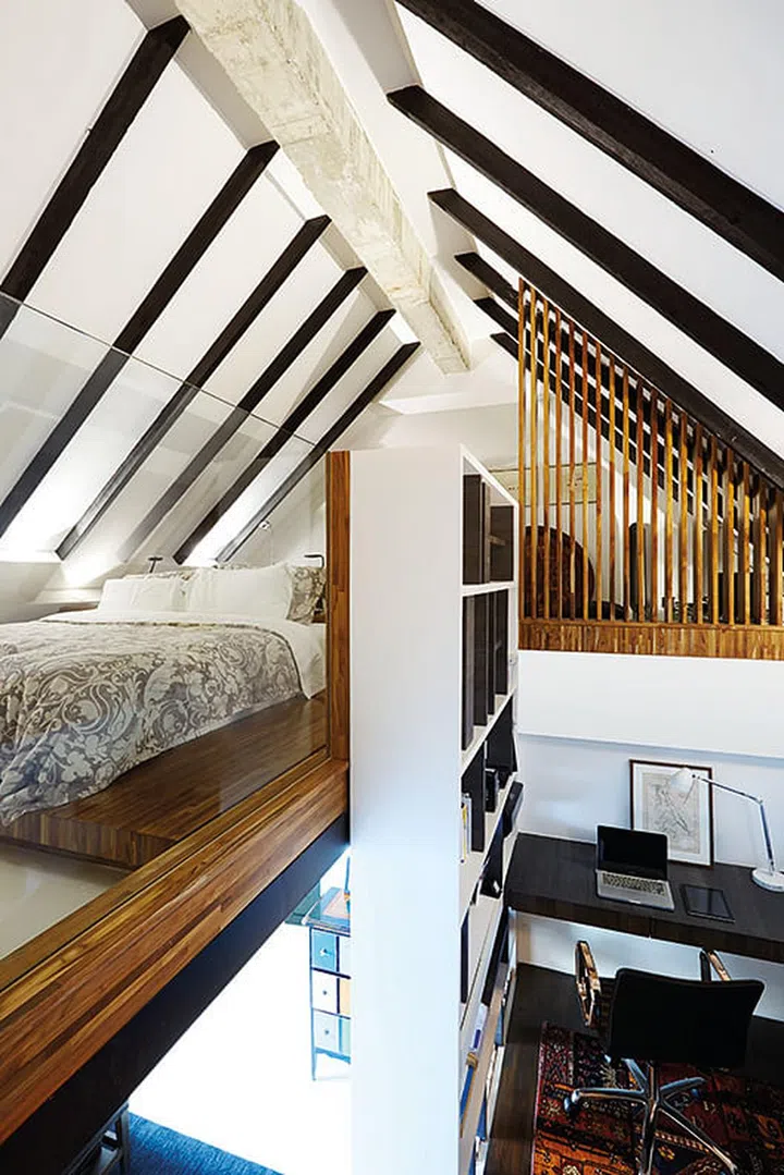 This newly uncovered space now functions as a private study, and leads the way up nicely to the couple's private hideaway.