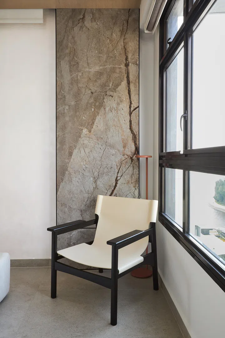 Chair in a corner in a couple’s 4-room BTO (1,001 sq ft) in Punggol.