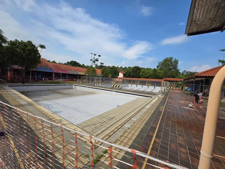 Renovation works of the common swimming pool in the middle of the Loyang chalets plot of land.