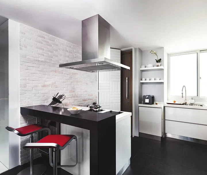 Applying brighter whites in areas like the kitchen and toilet helps reflect light to keep the spaces looking well-lit and clean.