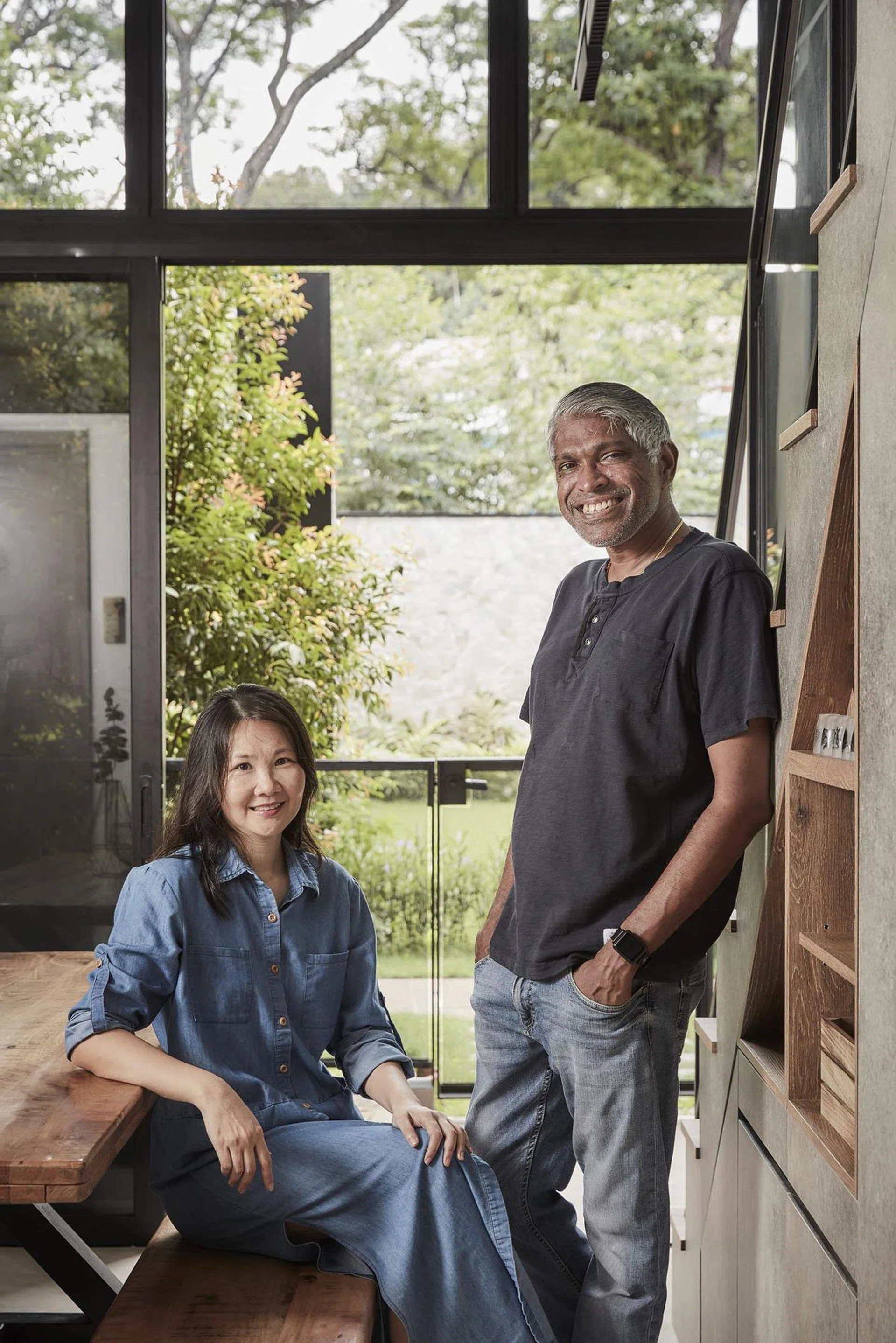 Homeowners Lynette Tan (left) and Jude Doss (right) poses for a picture in the living room of their 3-bedroom condominium at South Buona Vista Road.