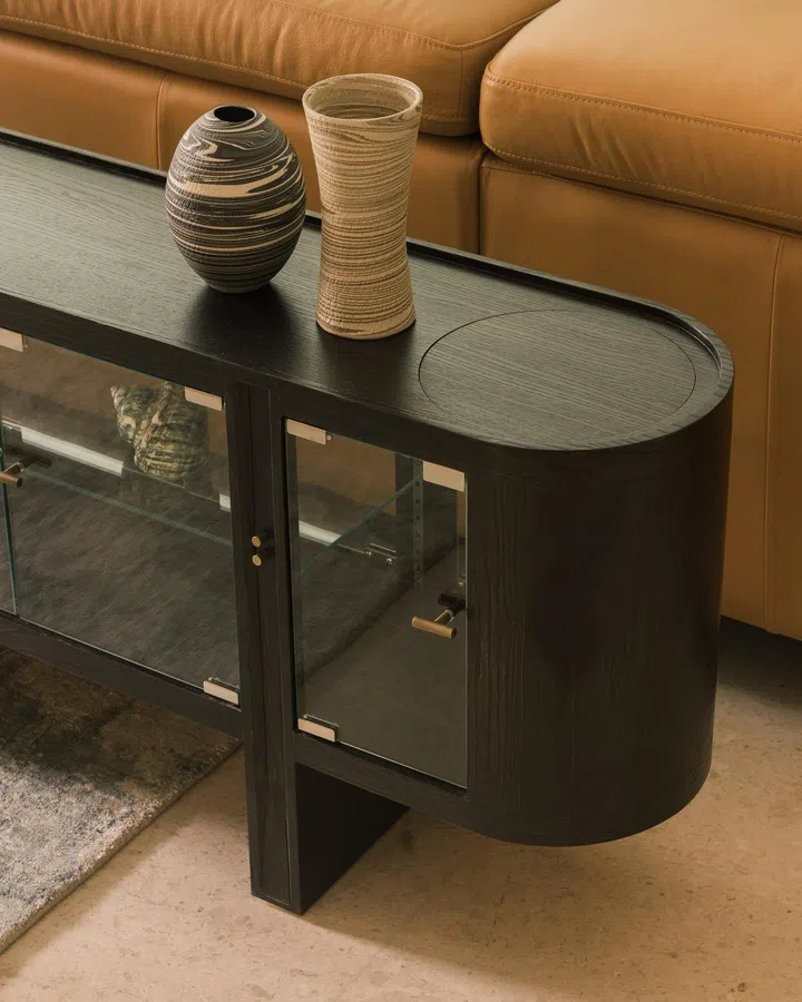 A custom-made display cabinet behind the sofa in this 6,534 sq ft semi-detached at Jalan Belibas, Upper Thomson designed by Metre Architects.