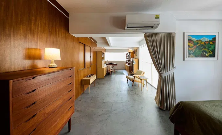 Natural light flows into the dining area from the full-height windows and door, adding to the ambience.