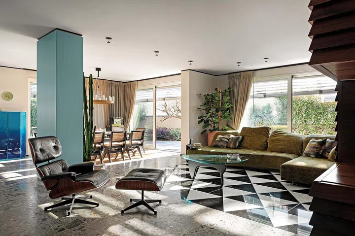 Eames lounge chair and ottoman. Coffee table by Isamu Noguchi from Vitra. Sofa by Edra.