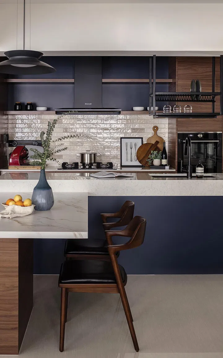 The design team customised a dining table with a sintered stone top to match the kitchen design.