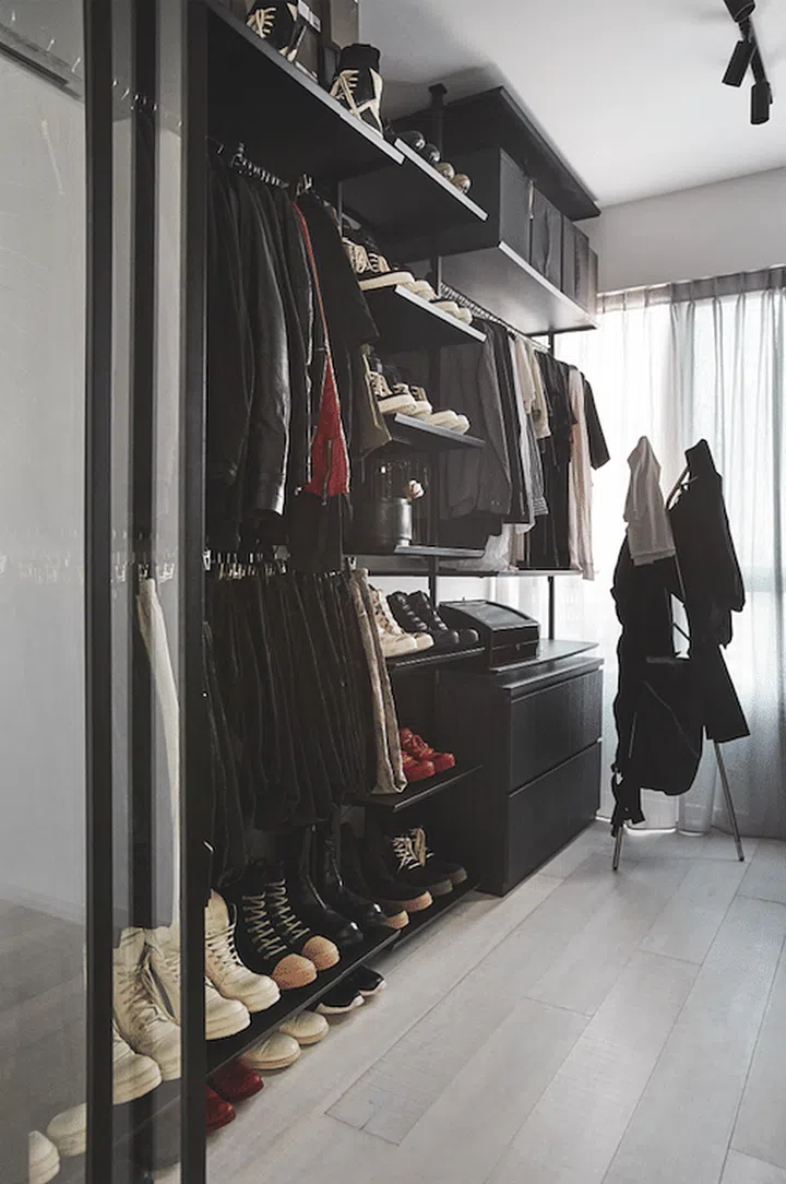 The stylish couple, Evon Chng and Joseph Ho, own expansive collections of clothes and shoes. They are showcased in the walk-in wardrobe, which was converted from a bedroom.