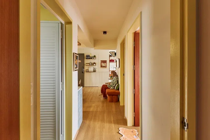 A long corridor connects the bedrooms to bright communal spaces that keep the family naturally connected every day.