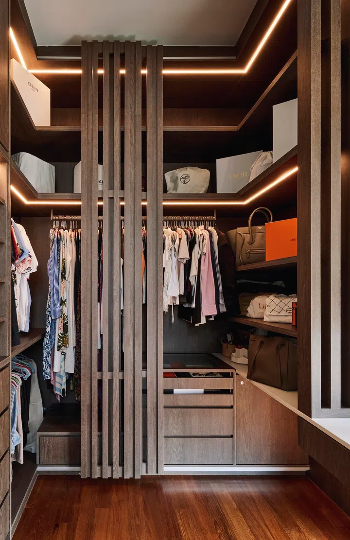 Converted from an adjoining bedroom, the new wardrobe flows seamlessly from the master bedroom and echoes the home’s slatted design language.