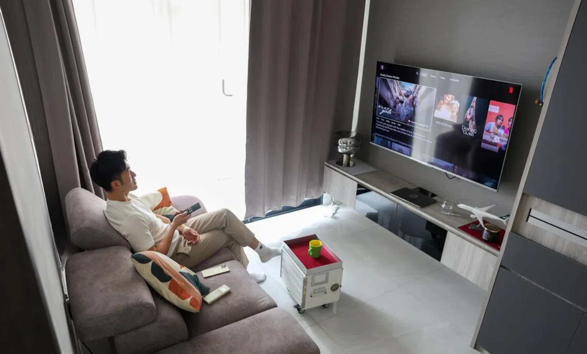 Mr Jon Phua lives in a shoebox condominium unit that forms part of a trend towards smaller private residences.