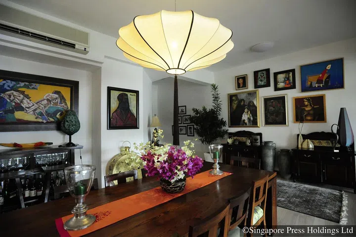 The centrepiece in the dining and living area of Pooja Kapur's condominium along Coronation Road West offers an all-round view of the family’s art collection.