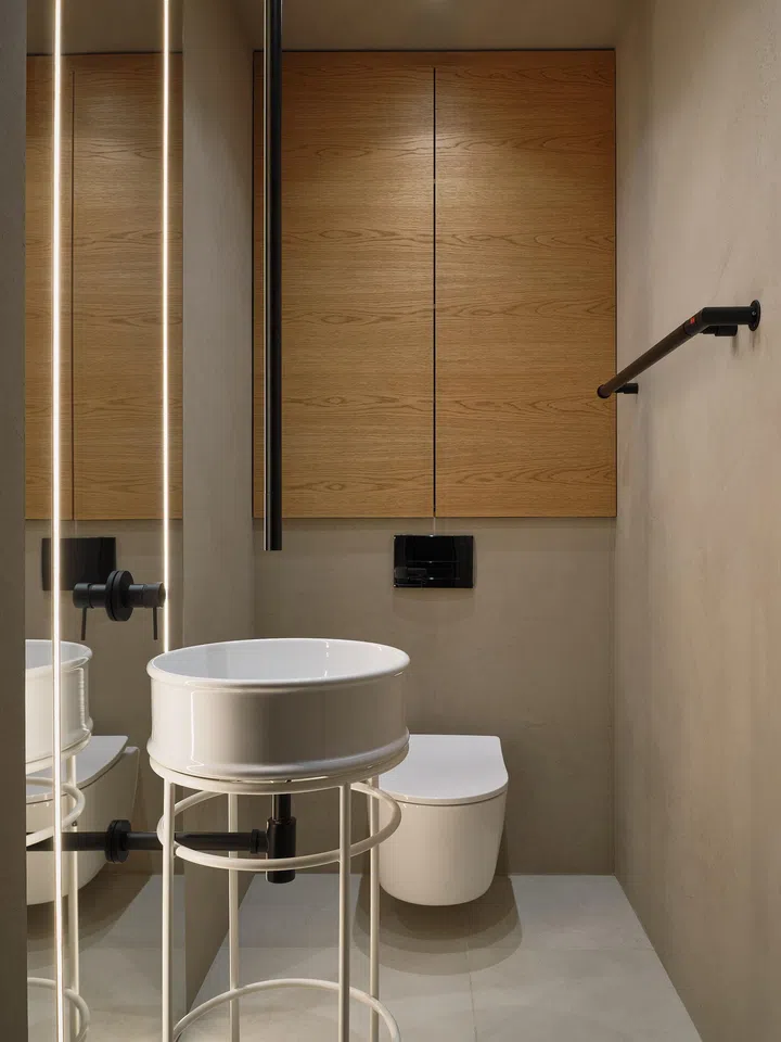 Tiles and walls are exactly the same as the rest of the home in this guest bathroom. 