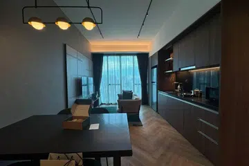 Overview of Quincy House's Two-Bedroom Deluxe living room and kitchenette spaces.
