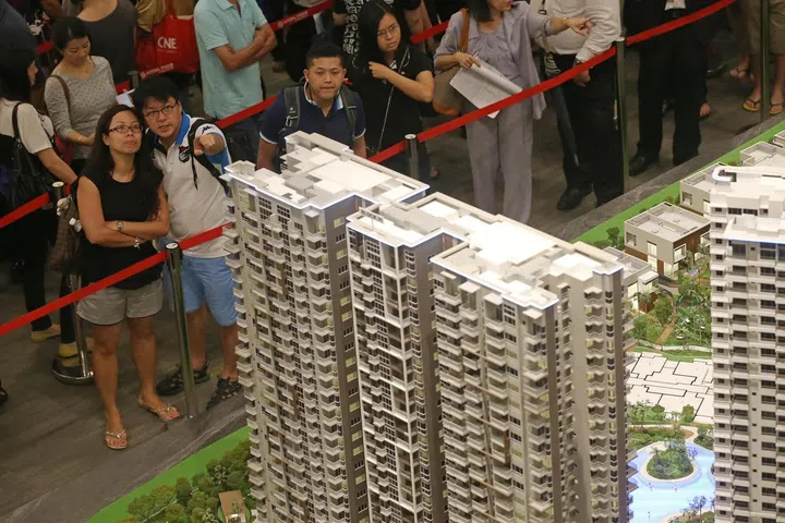 High Park Residences, a condo development in Fernvale, opens its booking phase on 17 July 2015. Buyers queue with their agents to book a unit after getting a ticket in a ballot process.