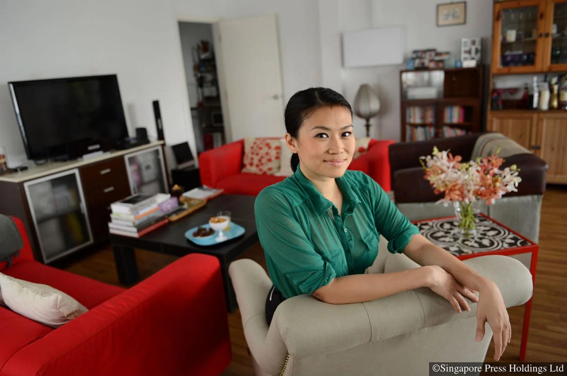 Local actress-host Cynthia Lee MacQuarrie at her rented 1,400 sq ft walk-up apartment in Chip Bee Gardens.