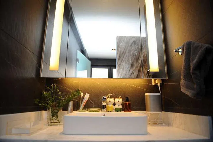 The bathroom has two wash-basins in this (originally) 3-bedroom condominium facing East Coast Park.