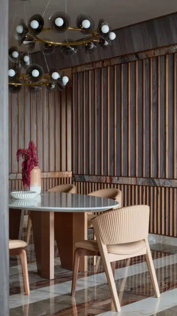 Notice how the colours from the walls are reflected on the floors as well in the general living spaces of this home by Pooja Bihani. 