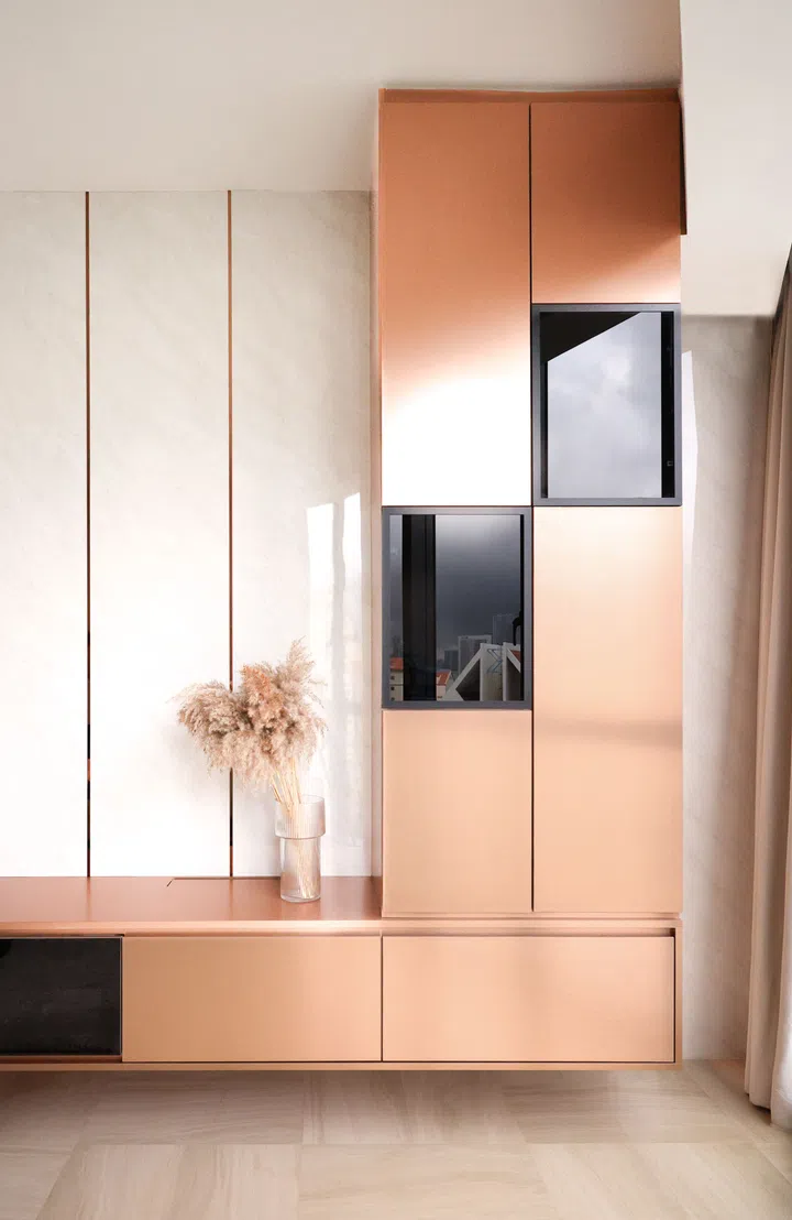 The use of copper-esque material brings warmth and balance to the living area.