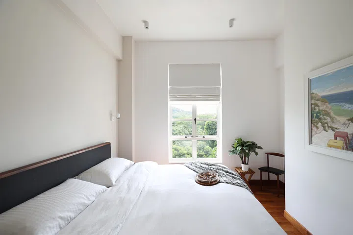 An airy palette of whites keeps the new master bedroom light and breezy, complete with a walk-in wardrobe.