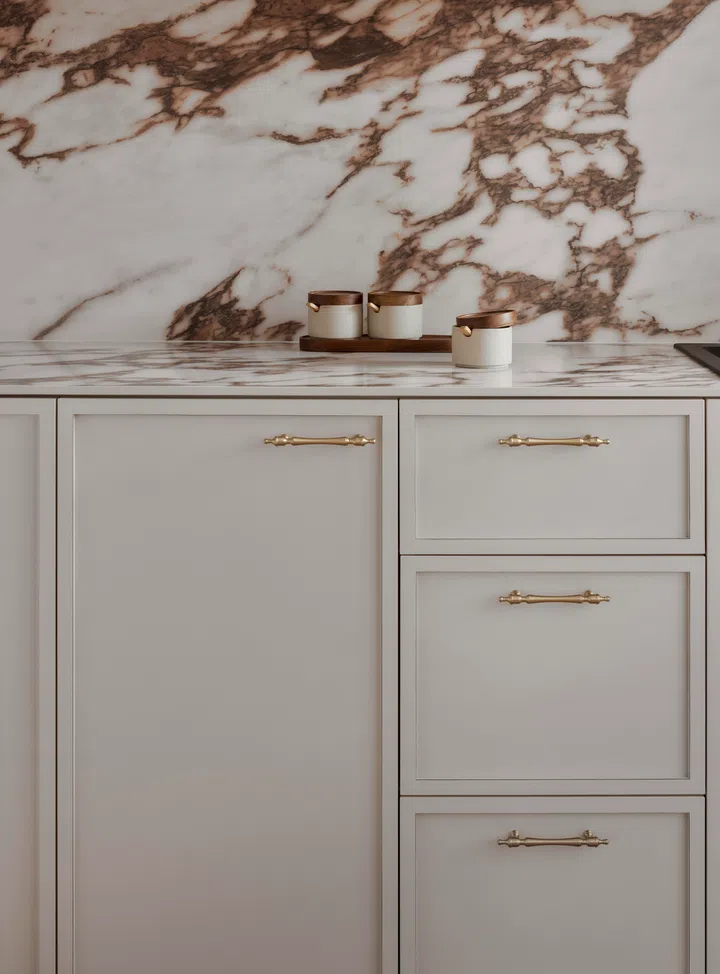 Shaker-style cabinets in the kitchen of a 4-room HDB BTO (1,004 sq ft) in Bishan, designed by RENOSTUD.IO.