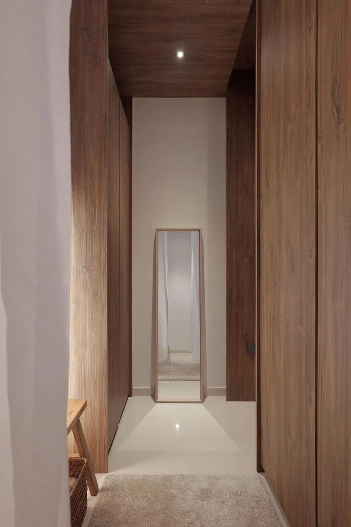 This space, which connects to the bathroom, is where the homeowner moves to for her shoes and bag before heading out of her home.