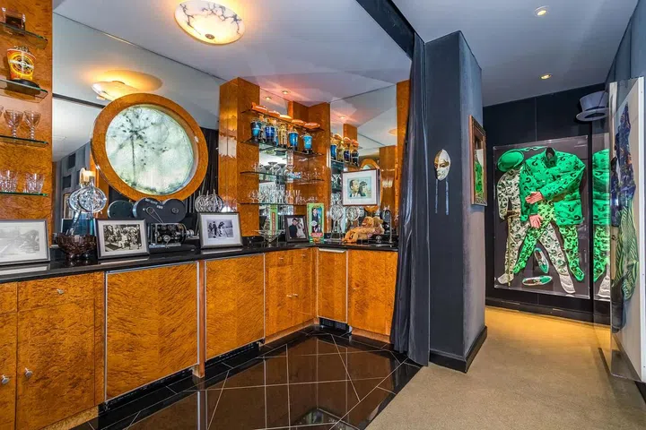 The theater's bar is decorated with memorabilia from Carrey's iconic films.