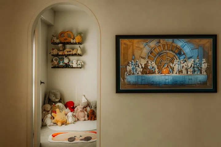 A common room is kept simple and relaxed, with soft toys and personal items bringing a sense of comfort to the space.