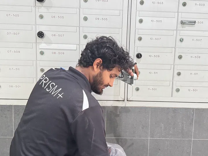 PRISM+ door lock installer helping out with the letterbox lock too.