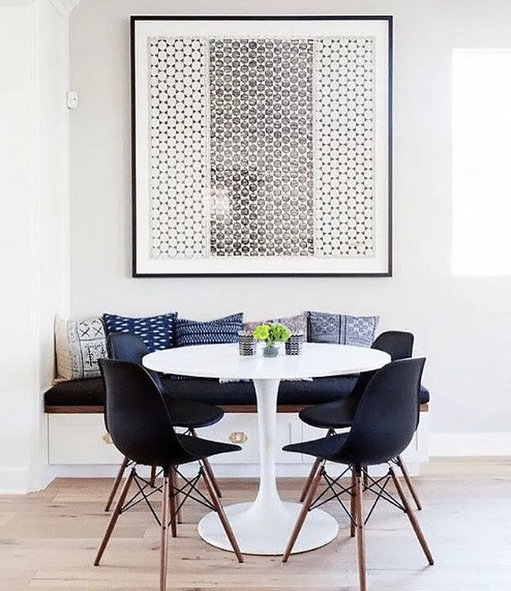 White round dining table placed at a small corner of a house