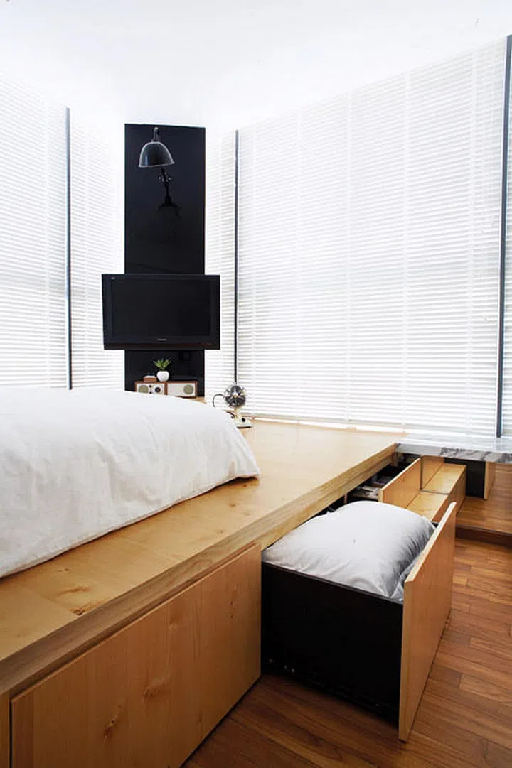 The storage potential of the platform is maximised by building cubbyholes and deep drawers within the structure. 