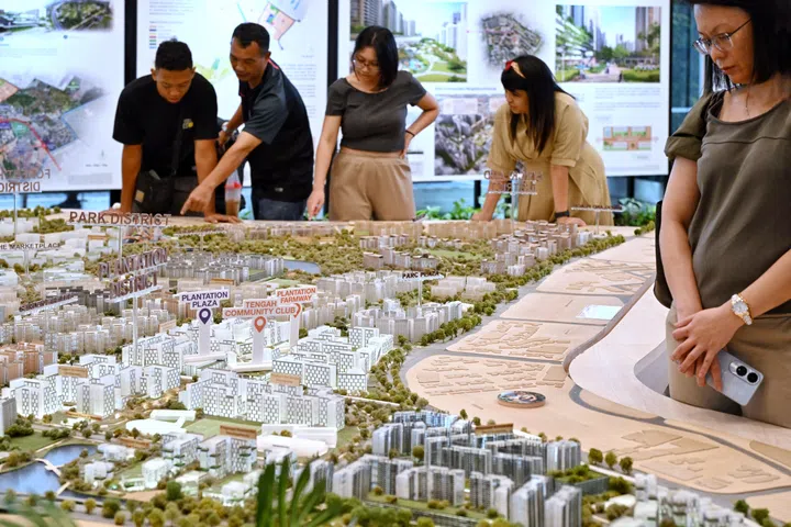 Generic pix of people looking at the exhibits of various HDB developments at the HDB Hub in Toa Payoh central on Oct 23, 2024. 