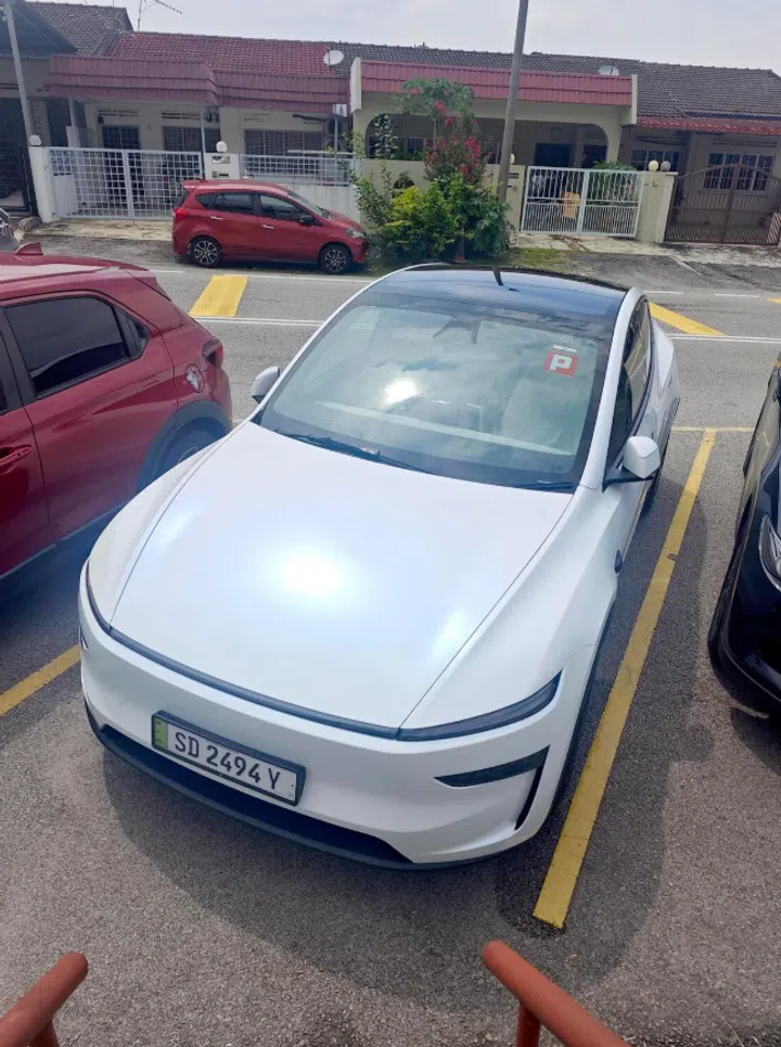 The couple bought a Tesla Model Y for $70,000 and charge the electric vehicle at home.