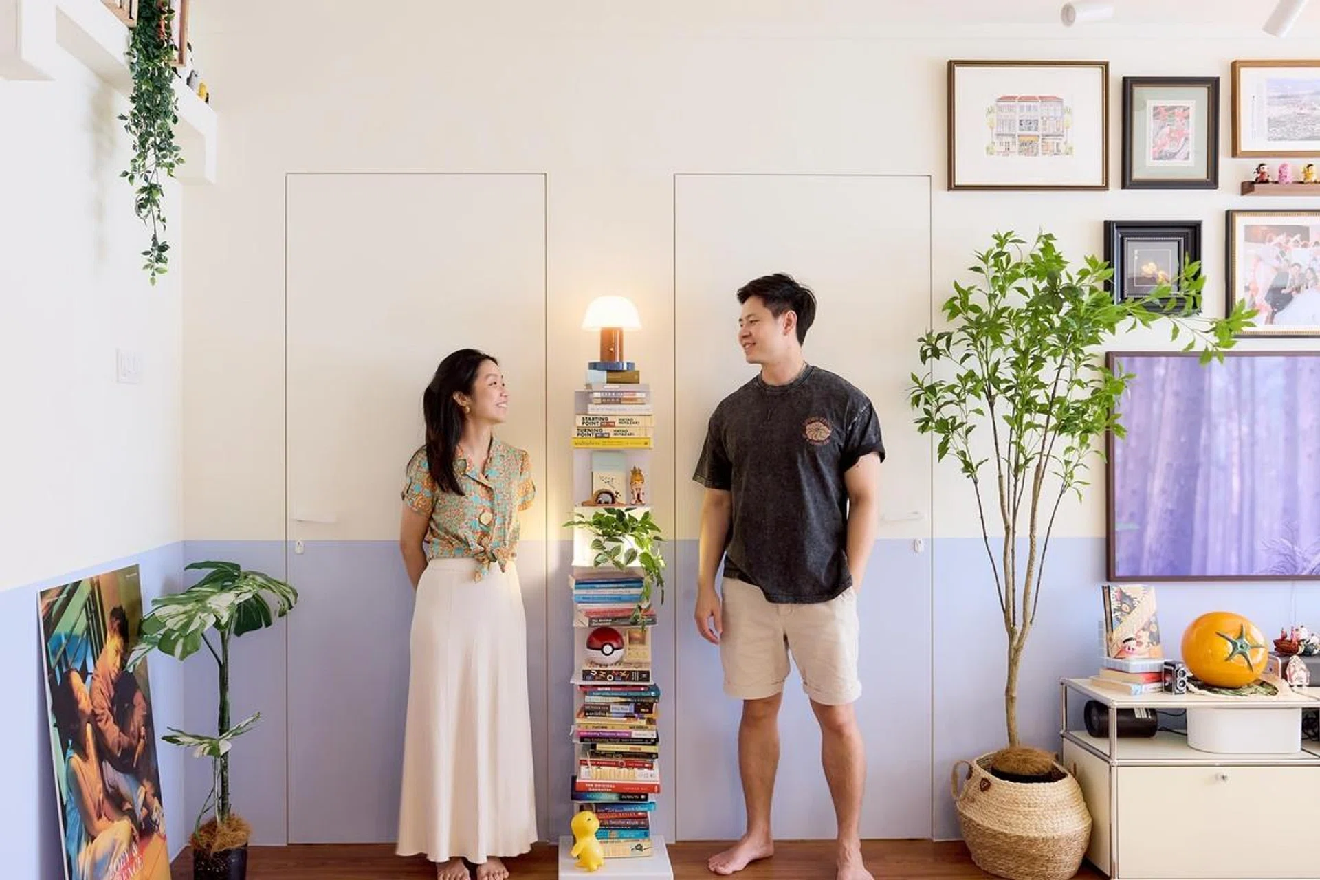 Homeowners Terence Chua and Zoey Lee pose for a photo in their 5-room HDB flat in Yishun, designed by Homely Matters Pte Ltd.