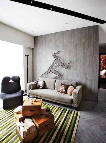 In the living area, tiles textured to resemble wood grain provide the warmth of wood flooring and are easier to maintain.