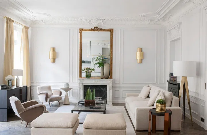In this classical European interior design-styled apartment, decorative wainscotting was white-washed for a modern look.