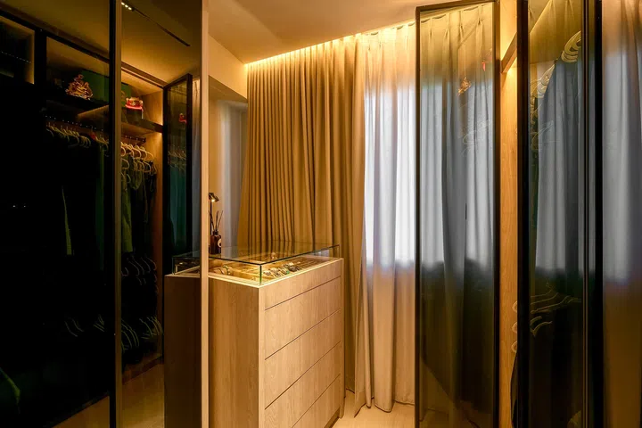 The second bedroom now functions as a spacious walk-in wardrobe with a central display island.