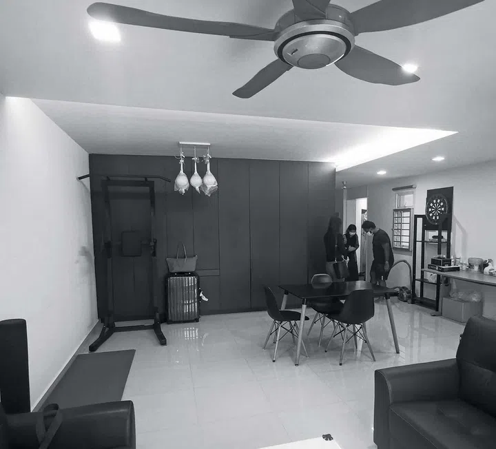 A small dining room with a small round dining table