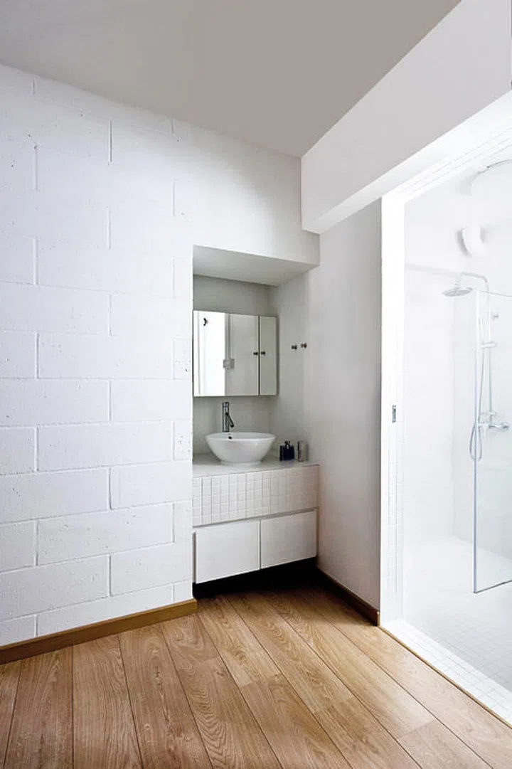 This inset sink counter in the master bedroom frees up space in the bathroom proper, and allows husband and wife to use either area independently. Interior design by Box ID Studio