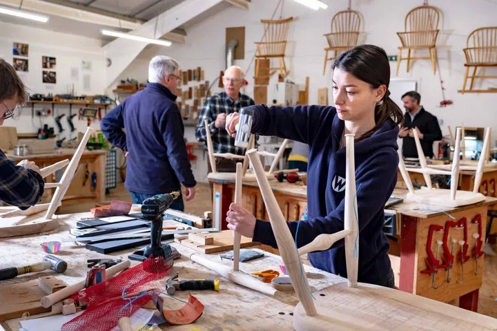 3 Women and 3 men on chair making course.