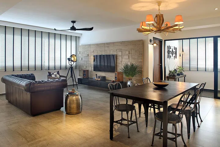 This HDB flat has a much larger living and dining area. Making it easy for the owner to demarcate the two spaces. This owner used a unique lighting feature to set the space apart from the living room. Interior design by The Scientist