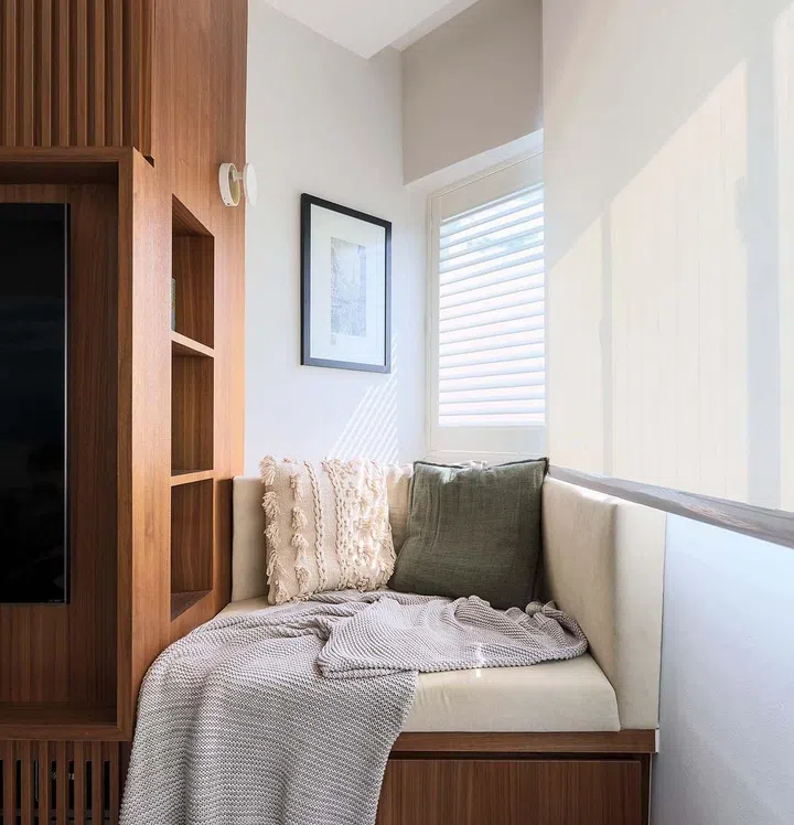 This odd corner has been turned into a cosy nook the family members love snuggling in.
