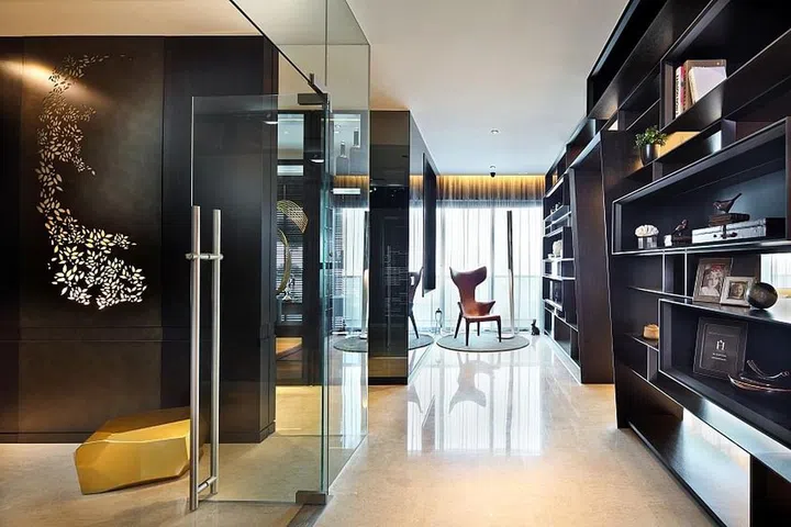 A corridor in the home is dressed up by incorporating display shelves with an abstract geometric design.