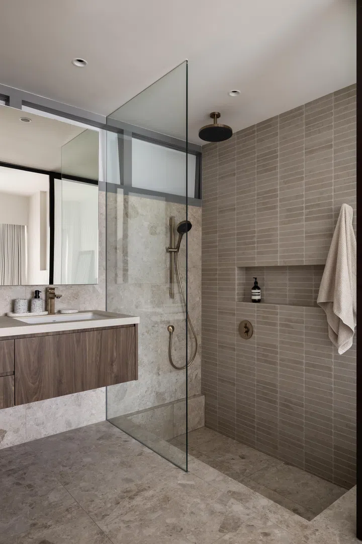 All of the bathroom’s wall and floor tiles are Hafary. 