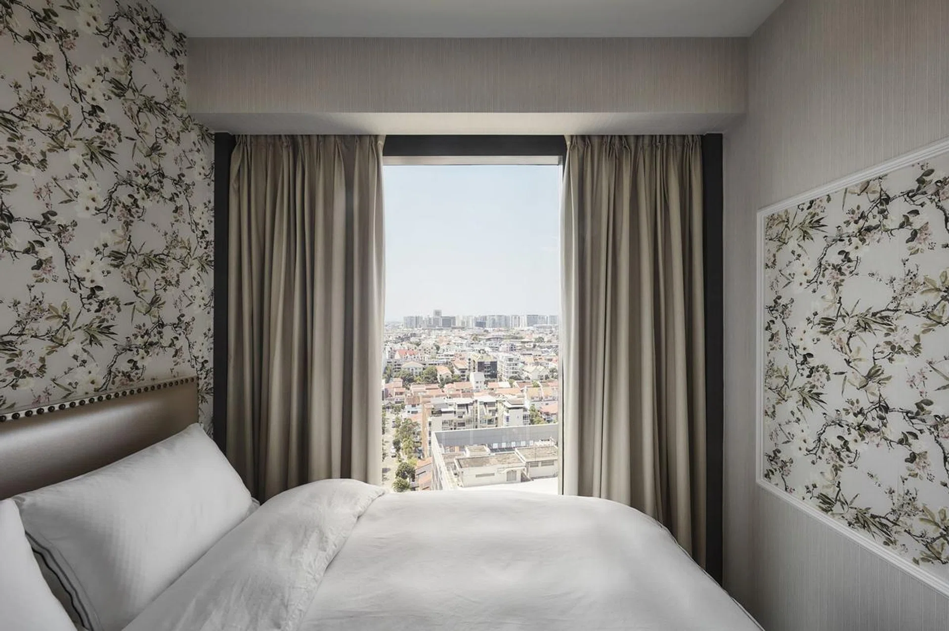 European-style master bedroom in a flight steward's 2-bedroom with study condominium along Sims Drive.